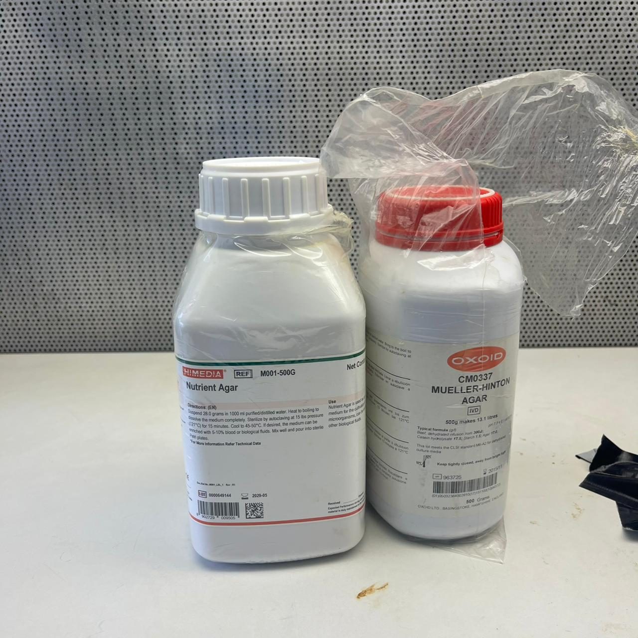 Two bottles of nutrient agar and Mueller Hinton agar culture media